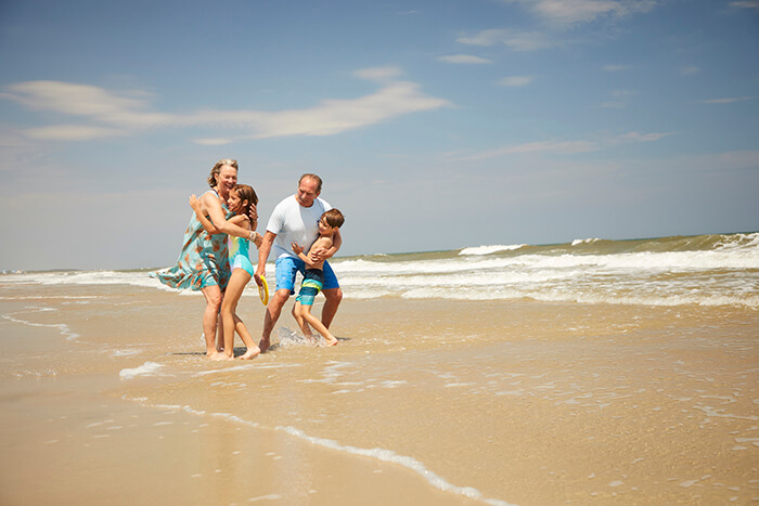 Family on the beach in Pawleys Island, SC