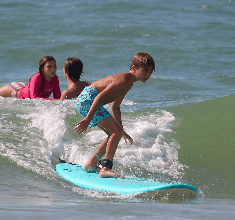 Kid riding wave-onlypawleys